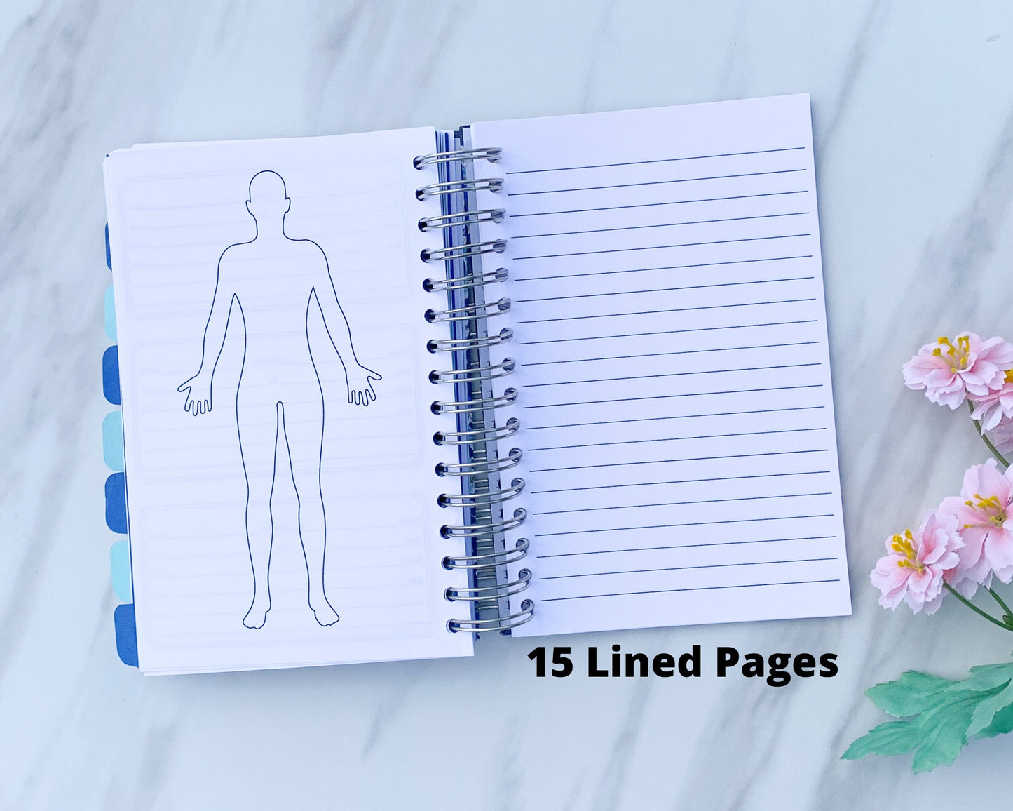 The spiral book is open to show a large body outline on the left page and a lined page on the right. A note below the lined page says 15 Lined pages.