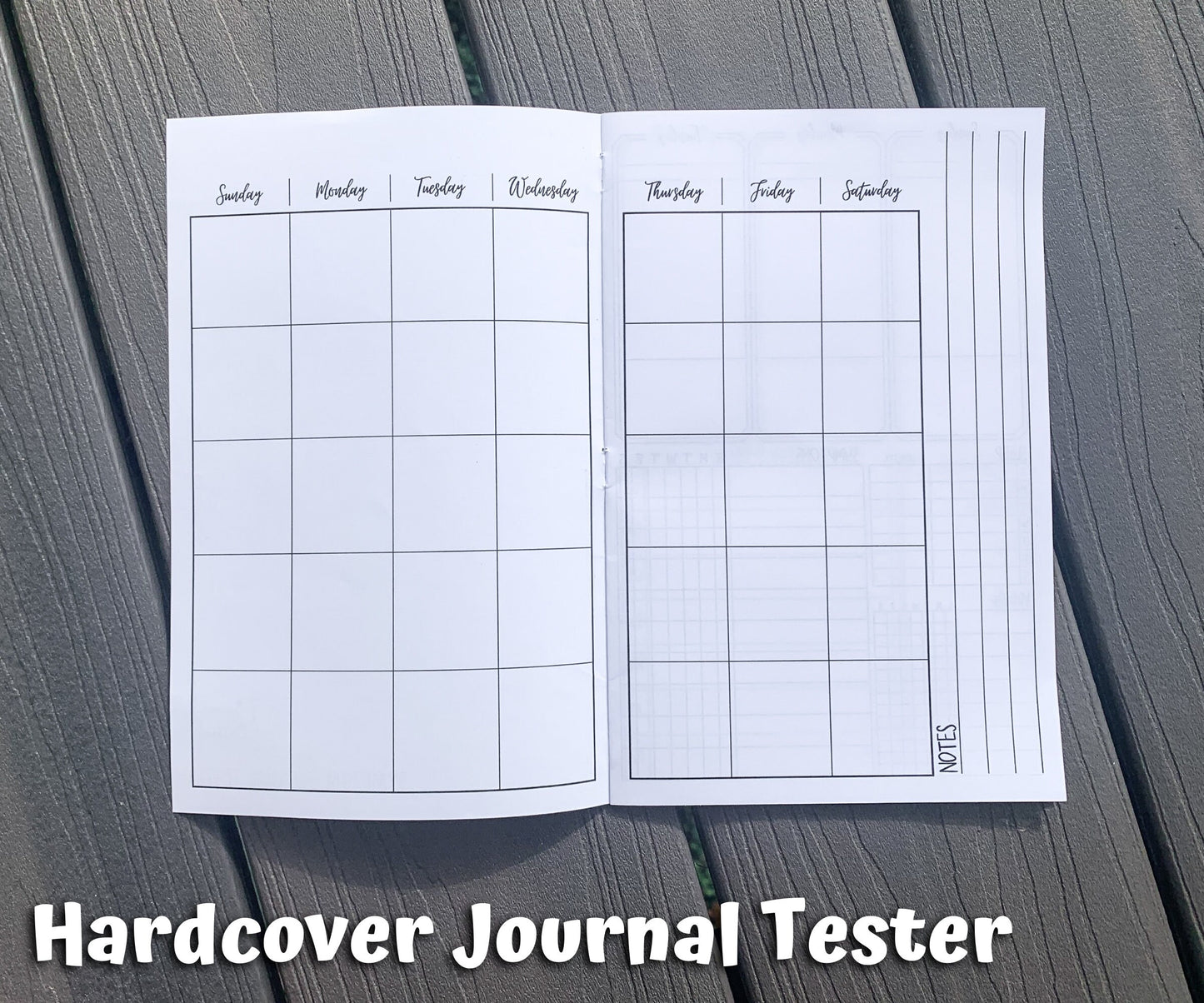 The calendar page of the hardcover journal is shown. There are 7 columns, 5 rows deep of squares with no dates. At the top of each column are the days of the week, but no color background. On the right page next to the box of squares you there are 3 vertical lines lining perpendicular to the way info would be written in the boxes. Notes is written on the left of the top line when facing to write.