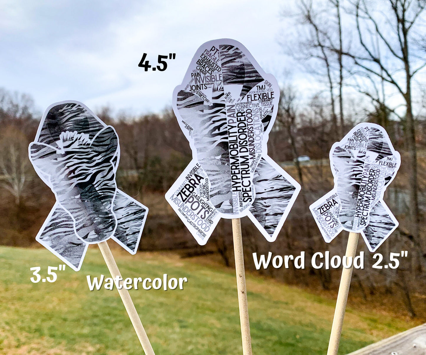3 sizes of the stickers are shown. 3.5 inch, 4.5 inch, and 2.5 inch. It also shows that the watercolor design is all color and no word cloud and the word cloud is the design with each section split in half with the word clouds