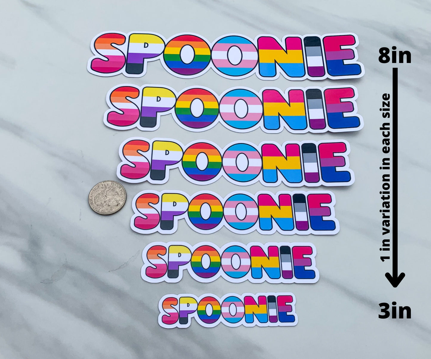 The spoonie sticker is shown in 6 sizes. They range from 8 inches to 3 inches with 1 inch variation in size. There is a quarter sitting next to the 5 and 6 inch stickers for size comparison