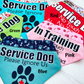 5 Bandanas are shown on a white marble background. The bandanas are labeled with their colors- Aqua, Green, Red, Pink, and Blue.