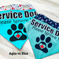 Aqua and Blue bandanas are shown for comparison. Aqua is much brighter and blue is a dulled blue color. Aqua has the old fire hydrant and bones contrast but this would be replaced with the new fabric. The blue fabric has the navy fabric with matching blue plaid paws, light blue hearts, and white bones for contrast. The blue fabric uses navy vinyl instead of black for aqua.