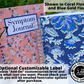 The large floral pink and smaller floral blue book are shown closed standing up. A note says shown in coral flowers and blue gold floral. An arrow is pointing to the label on the pink journal and attached to a note that says OPtional Customizable Label. Choose add-on customization level and write what text you want. Please check your email- you will be emailed font/color options after purchase. A circle to the right has a logo for one tree planted and says this product plants one tree.