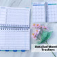 Detailed Monthly Tracker. A book is shown open sideways on a marble surface. The top page says Tracker. There are 5 large boxes with a grid numbered 1 to 31 next to it. Each horizontal line of the grid is labeled low, medium, high. The bottom page's box has 9 rows. Next to the blank area for writing are boxes labeled 1 to 31. It is not a grid. There is a box at the bottom that says Key and has 4 boxes with lines next to each. A photo of the calendar page is in the upper right corner.