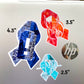 A silver laptop is shown with a 4 1/2 inch word cloud MECFS ribbon compared to a 3 1/2 inch watercolor CRPS and a 2 1/2 inch word cloud POTS sticker.
