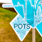 A close up of the bottom part of the ribbon of the word cloud design. You can see the words clearly in matching shades of turquoise. The words are things like Gravity, Horizontal, POTS, Tilt Table, Headaches, IV, Invisible, Fainting, Salt, Nausea, Propranolol, Balance, and more.