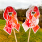 The word cloud and watercolor designs are shown on 2 sticks. Both ribbons feature an orange red awareness ribbon with fire in the center. The word cloud design on the right is split in half with a word cloud on the left half of the ribbon and heart beat and right half of the flame.