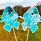 The word cloud and watercolor designs are shown on 2 sticks. Both ribbons feature a turquoise awareness ribbon with a heart and heart beat line in the center. The word cloud design on the right is split in half with a word cloud on the left half of the ribbon and heart beat and right half of the heart.