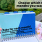 The book is being held up without the cover to show the tabs. The first tab is labeled Months and trackers, it is light blue with a darker blue angled pocket. The other tabs are November to April and Notes. The tabs alternate between light blue and dark blue, with white writing on the darker tabs. A note says choose which 6 months you want. Another note says Tabs for each month, pocket on months and tracker, and notes tabs only. Pockets are not meant to hold large amounts.
