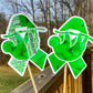 The word cloud and watercolor designs are shown on 2 sticks. Both ribbons feature a green color awareness ribbon with a hanging sloth in the center. The word cloud design on the left is split in half with a word cloud on the left half of the ribbon and right half of the sloth.