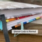 2 books are shown stacked. The bottom one has uneven ends and the top has flat ends.
