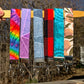 6 more wristlets are shown, in the colors Tie Dye, Pink Geo, Blue Geo, Red Plaid, Unlisted, Mauve Peach