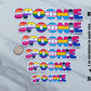 The spoonie sticker is shown in 6 sizes. They range from 8 inches to 3 inches with 1 inch variation in size. There is a quarter sitting next to the 5 and 6 inch stickers for size comparison